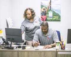 Antoine and Charmada in the office